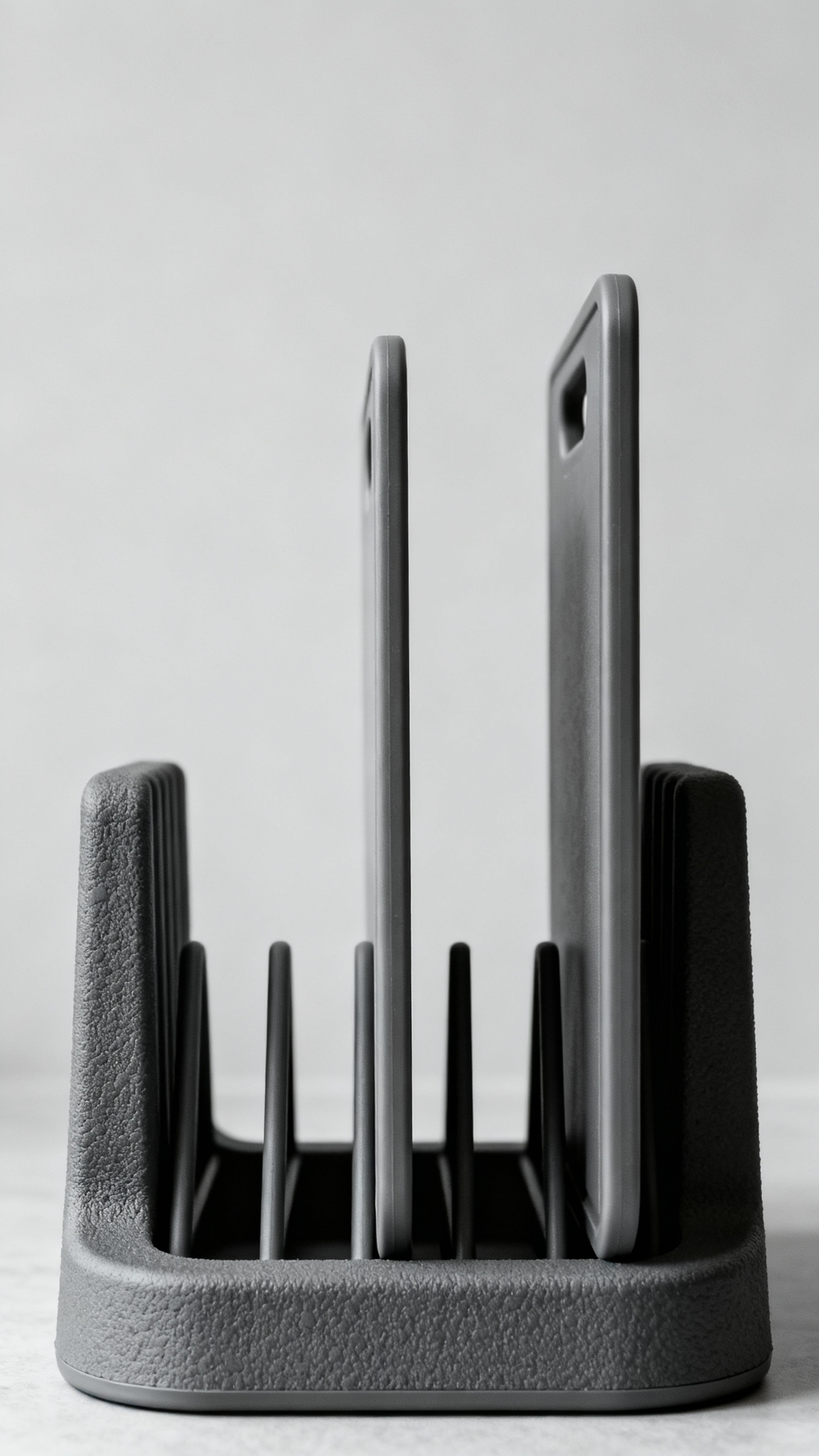 Rubber-coated U-shaped pan and lid rack holding cutting boards upright